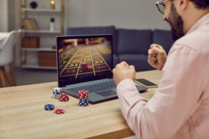 Man,Sitting,Back,At,The,Desk,And,Playing,Gambling,Betting
